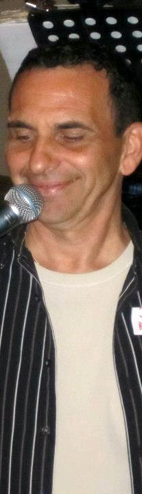 Jim behind a microphone
